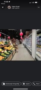 a grocery store aisle with fruits and vegetables at Italiana lux in Leskovac