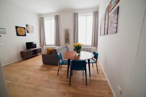 a living room with a table and chairs at Rolli Dream in Genova