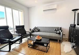a living room with a couch and two chairs at CostaBlancaDreams Casa Tinick in Calpe in Empedrola