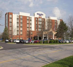 a parking lot in front of a large building at SpringHill Suites by Marriott Chicago Naperville Warrenville in Warrenville