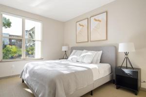 a white bedroom with a bed and two windows at Walnut Creek 2BR w Gym Pool Spa nr BART SFO-935 in Walnut Creek +26 photos