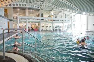 a group of people swimming in a swimming pool at Silverdale 21 in Warton