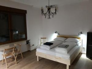 Posteľ alebo postele v izbe v ubytovaní Deviza Apartments