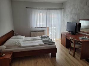 Posteľ alebo postele v izbe v ubytovaní U Juhasa Miętówka