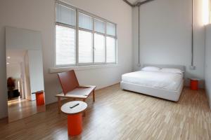 A bed or beds in a room at BasicVillage Milano