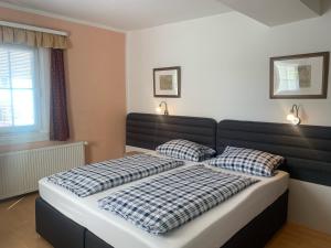 a bedroom with a bed with two pillows on it at Zum weißen Ross in Nidda