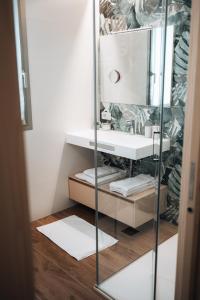 a bathroom with a sink and a mirror at Sea Breeze in Caorle