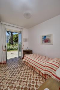 Säng eller sängar i ett rum på Villa in Via Tragara