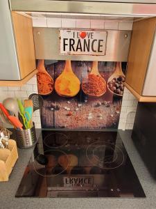 a kitchen with a display of different types of food at Résidence du Lac-Disneyland Paris-TARIF FAMILIAL in Émerainville