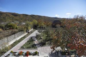 an aerial view of a garden with flowers and a building at Aragvispiri wine cellar in Aragvispiri