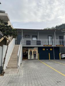 two people walking into a building with a staircase at MirAlya Homes in Fethiye