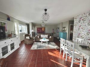 a living room with a couch and a table at ATICO ELOY DELGADO in San Miguel de Abona