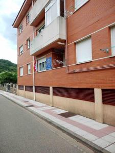 a building on the side of a street next to a building at La Plata VUT LE 0614 in León