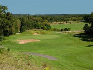 a view of a green golf course with a hazard sqor at appart 6 pers vue mer classé 3* in Saint-Raphaël