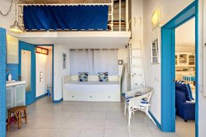 a bedroom with a bunk bed in a room at Casa da Praia in Vila Baleira