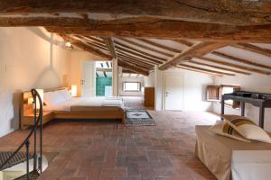 a bedroom with a bed in a room at Albergo Diffuso Borgo Santo in Asciano