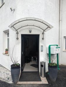 an entrance to a building with an open door at Hotel Eiserner Anton in Bielefeld