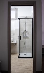 a glass shower in a bathroom with a sink at Guest House Bellavista Nebida in Nebida +78 photos