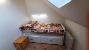 Llit o llits en una habitació de Podkroví v Jihočeském Statku