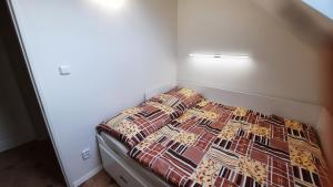 Llit o llits en una habitació de Podkroví v Jihočeském Statku