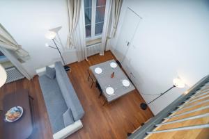 a living room with a couch and a table at Solmi Home in Modena