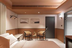 Postel nebo postele na pokoji v ubytování Lin Suites by Olala Homes