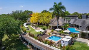 an aerial view of a house with a swimming pool at Ilala Lodge Hotel in Victoria Falls
