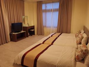 Postel nebo postele na pokoji v ubytování Mu Xi Ocean View B&B