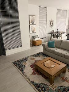 a living room with a couch and a coffee table at 3 Story Luxury Apt Las Olas FTL in Fort Lauderdale