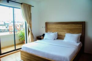 Postel nebo postele na pokoji v ubytování Hotel Capitol