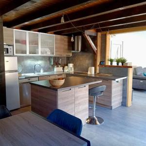 a kitchen with a sink and a counter top at Chalet paisible 6 personnes in Uvernet