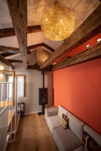 a living room with a couch and a chandelier at Casa del Carro 2 Grand Terrace Apartment in Venice