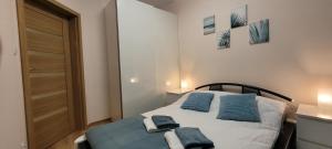 Postel nebo postele na pokoji v ubytování Sunset Resort Nadmorska 100A 36