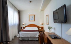 TV a/nebo společenská místnost v ubytování Hotel MS Tropicana
