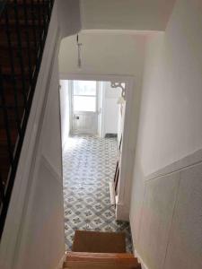 a hallway with a stairway leading to a door at Angels Homes-n27, 2ºfloor - Bairro Tipico, Centro Lisboa in Lisbon