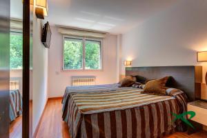 Postel nebo postele na pokoji v ubytování Apartamentos Xixerella Park Resort
