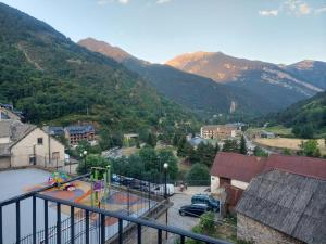 a view of a playground with mountains in the background at El Mirador Bielsa in Bielsa