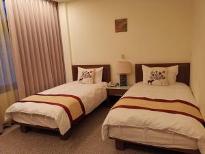 Postel nebo postele na pokoji v ubytování Mu Xi Ocean View B&B