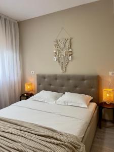 Postel nebo postele na pokoji v ubytování Boholand Apartment