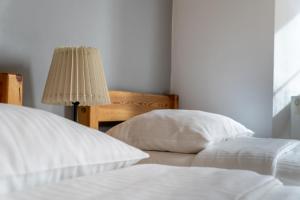 Posteľ alebo postele v izbe v ubytovaní Maya Pokoje i Apartamenty