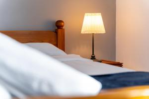 Posteľ alebo postele v izbe v ubytovaní Maya Pokoje i Apartamenty