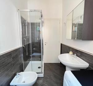 a bathroom with a shower and a toilet and a sink at Davide Rome Apartment in Rome