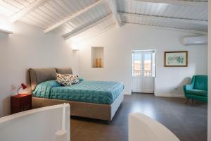 Ένα ή περισσότερα κρεβάτια σε δωμάτιο στο 2 Soru Ortigia Holiday Home - Romantico bilocale