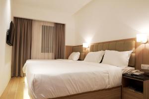 Postel nebo postele na pokoji v ubytování D Loft Hotel