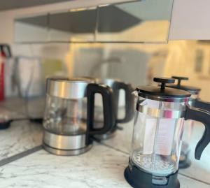 a blender sitting on top of a counter with other appliances at Daisy Blossom Studio in Bromley