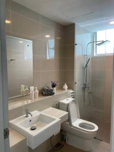a bathroom with a sink and a toilet and a shower at 3bedroom Sutera Avenue Kota Kinabalu by Twen8ty Homestay in Kota Kinabalu