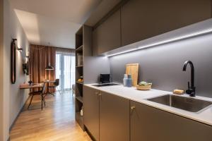 a kitchen with a sink and a counter at ipartment Berlin Airport in Schönefeld