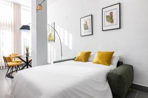 Posteľ alebo postele v izbe v ubytovaní Caramba FreshApartments