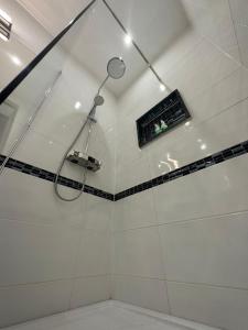 a bathroom with a shower with a window at V Apartment Šibenik in Šibenik +45 photos