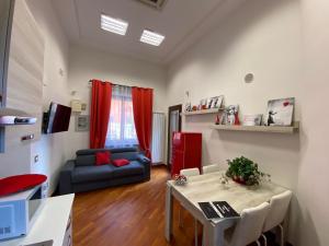 a living room with a table and a couch at Zara Palace in Scafati